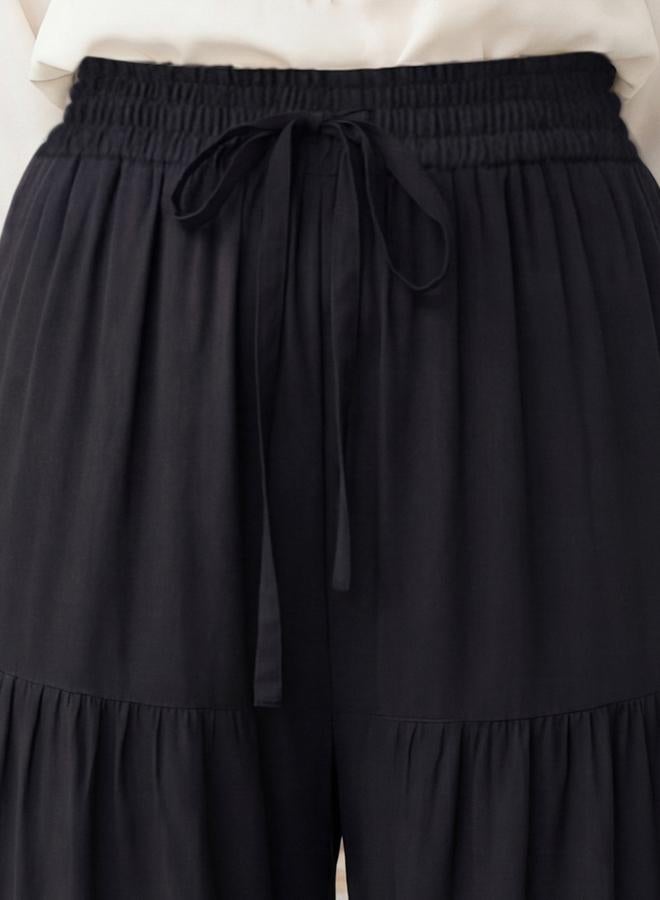 جلو باص بنطال بالازو أسود متعدد الطبقات بخصر برباط وحافة واسعة - Image 4